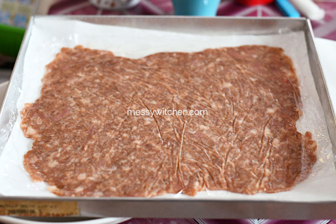Transfer Rolled Minced Pork Mixture To Baking Pan